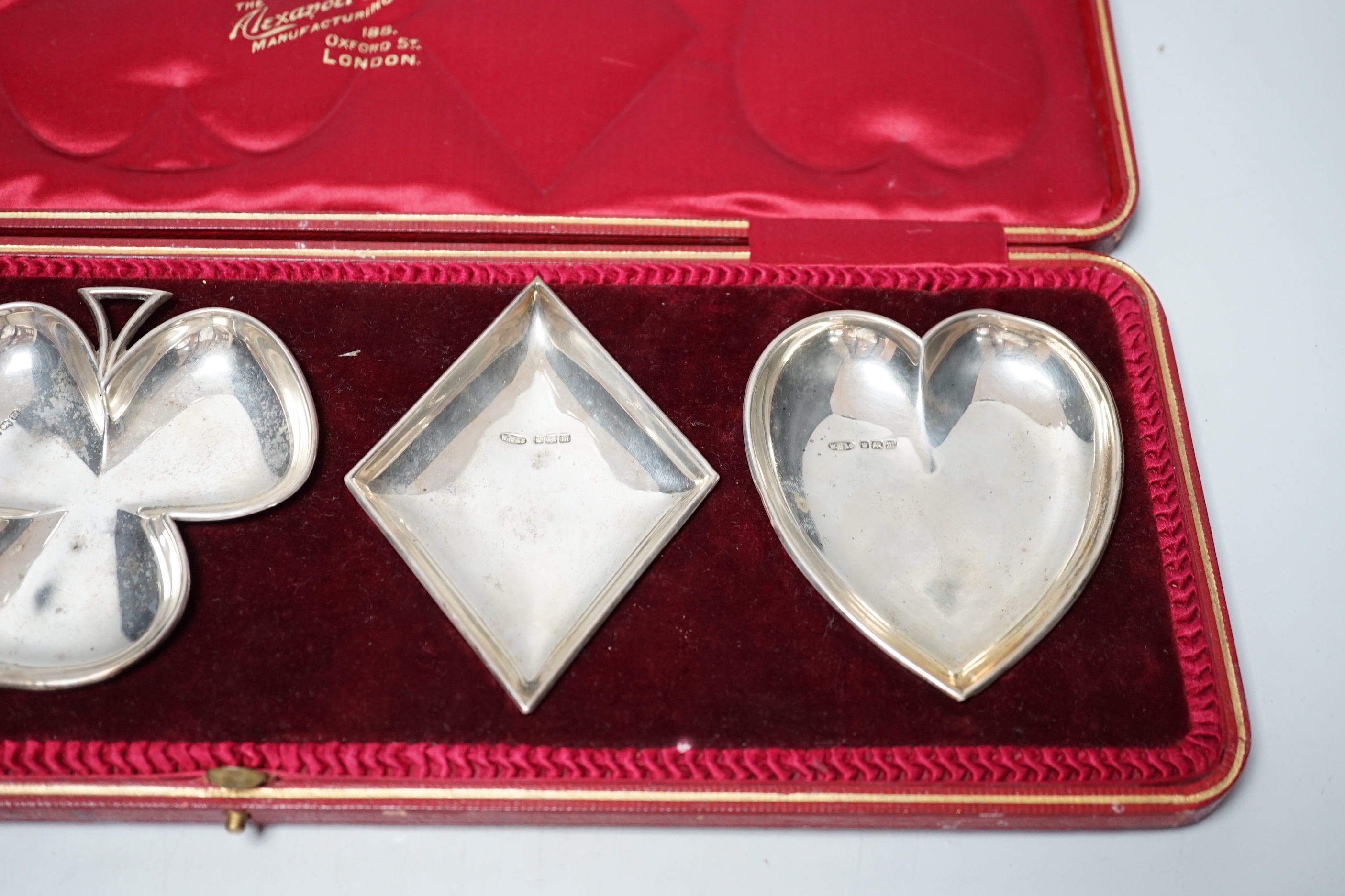 An Edwardian cased set of four novelty silver playing card suite shaped ashtrays, William Mammatt & Son, Sheffield, 1904, heart dish 94mm.